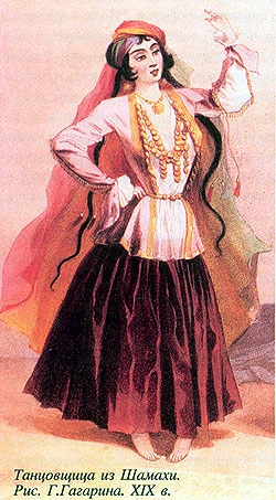 Azeri woman dancer wearing a chutga on her head.