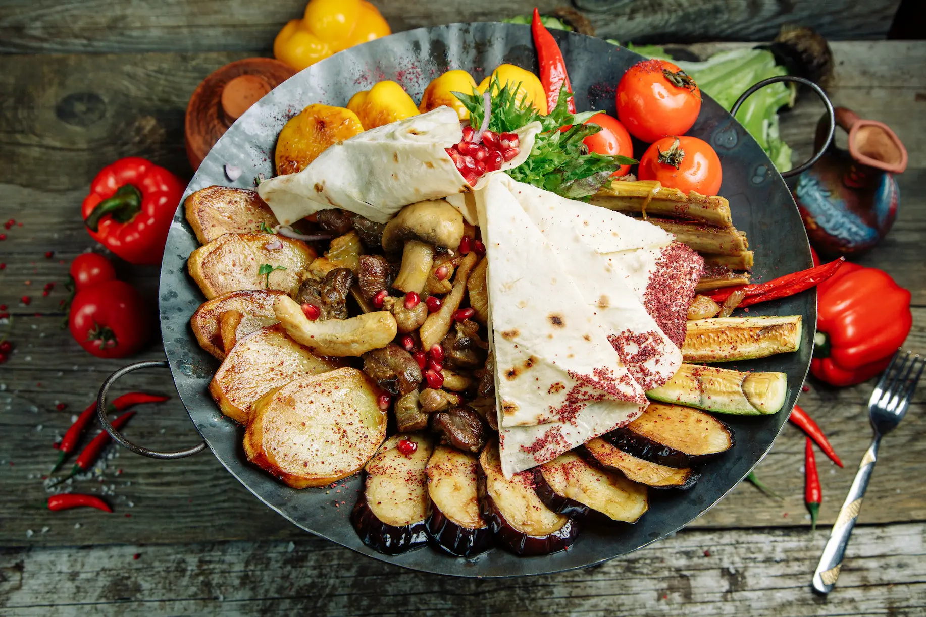 Azerbaijani food Saj with meat and vegetables altogether.
