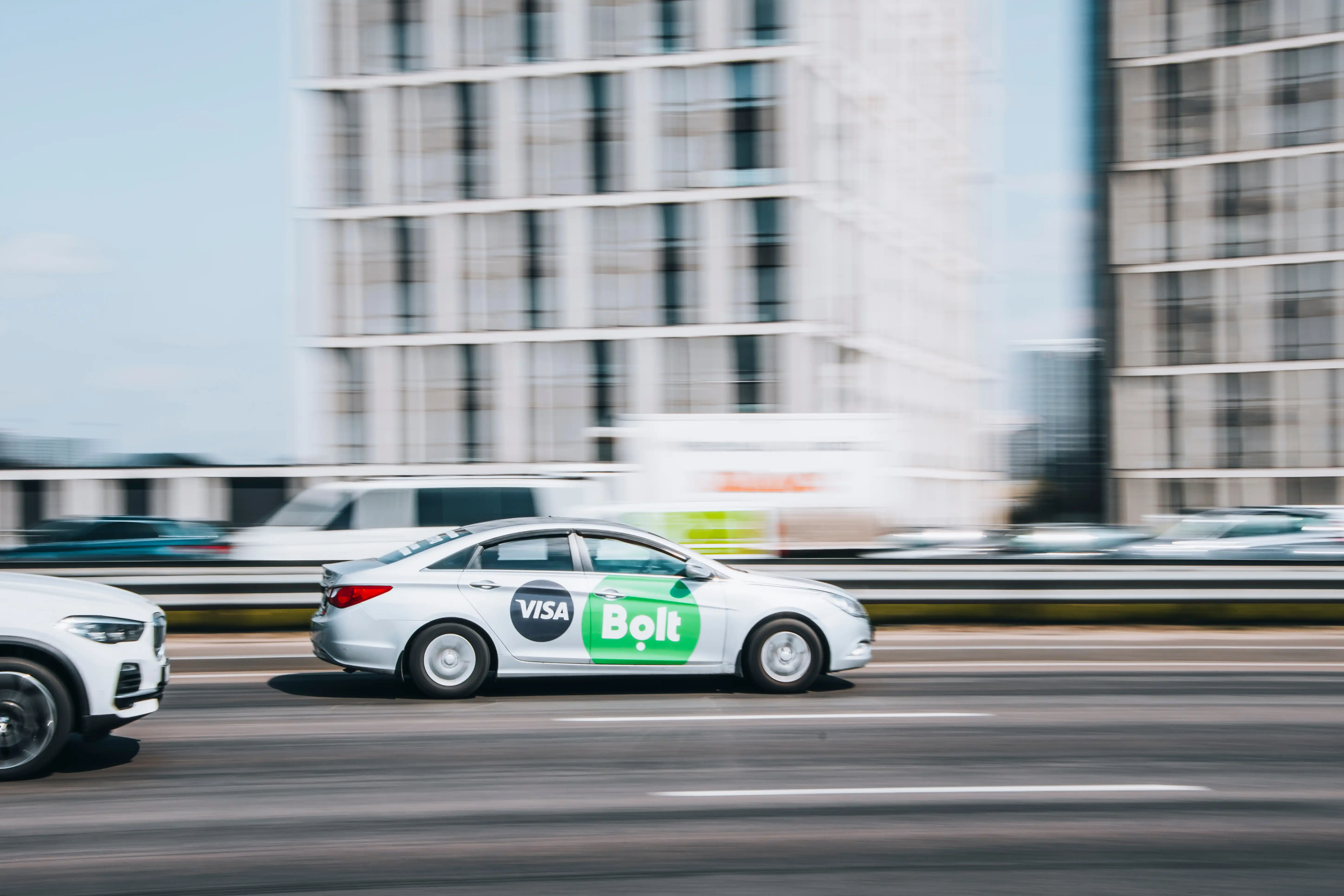 Bolt taxi of Azerbaijan driving on a highway on a sunny day.