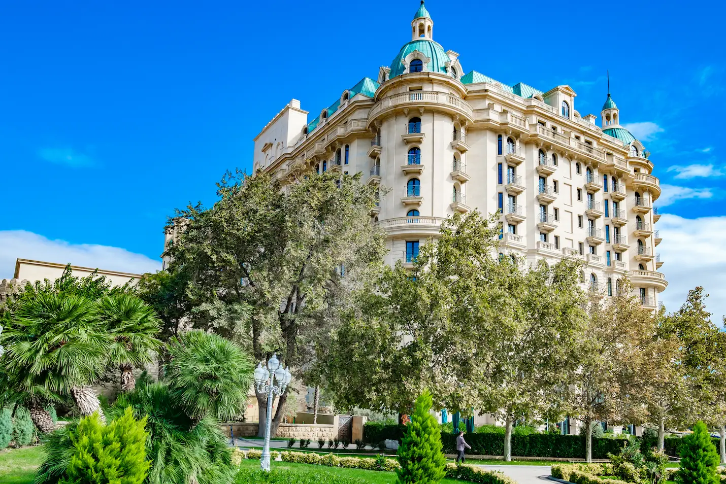 Four Seasons Hotel Baku amid lush greenery.