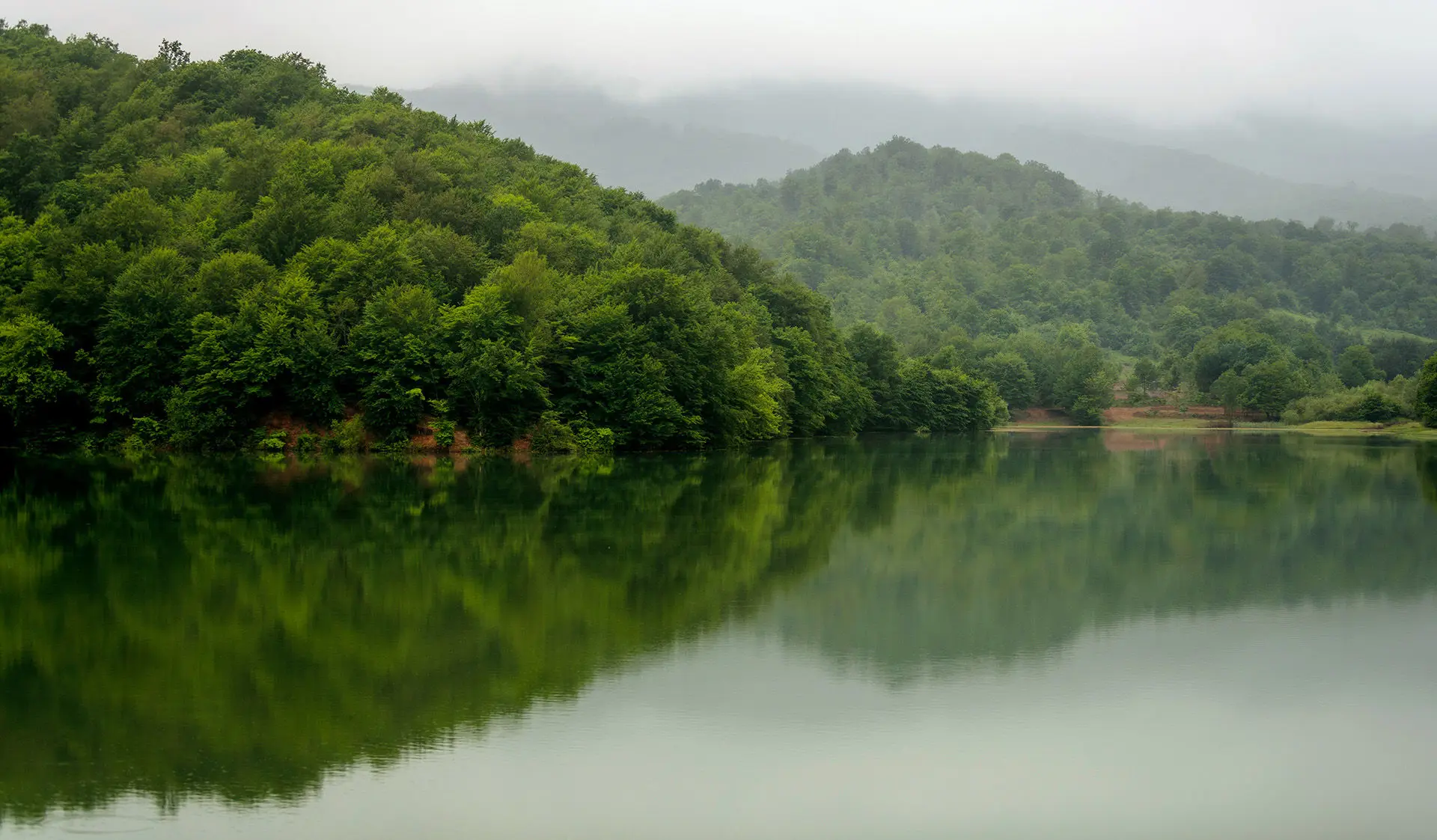 Scenic view of Lake Chanlibel in Quba, Azerbaijan, in cloudy and slightly misty weather.