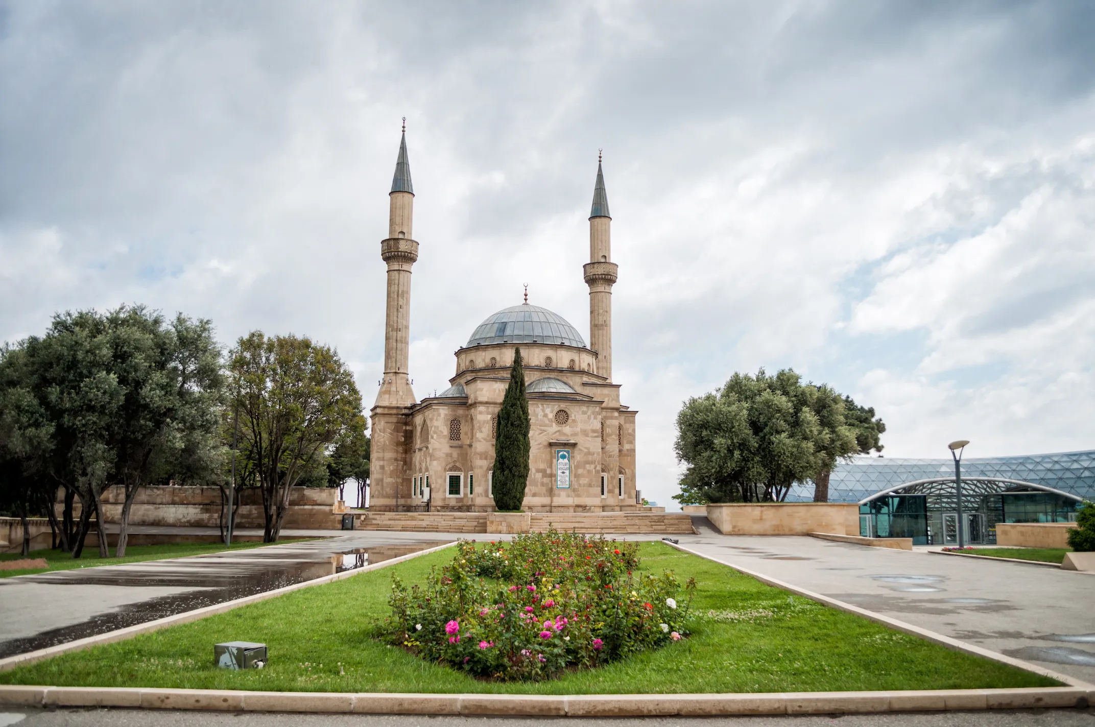 Mosque of the Martyrs near the exit of Baku Funicular in Upland Park on a cloudy day.