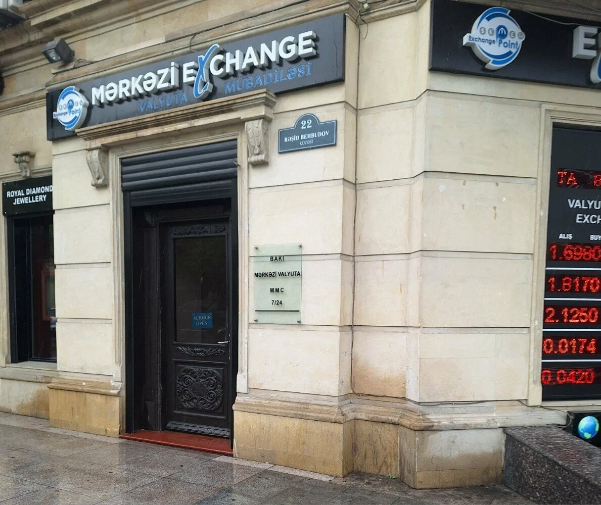 Merkezi Exchange on Rashid Behbudov Street on a rainy day.