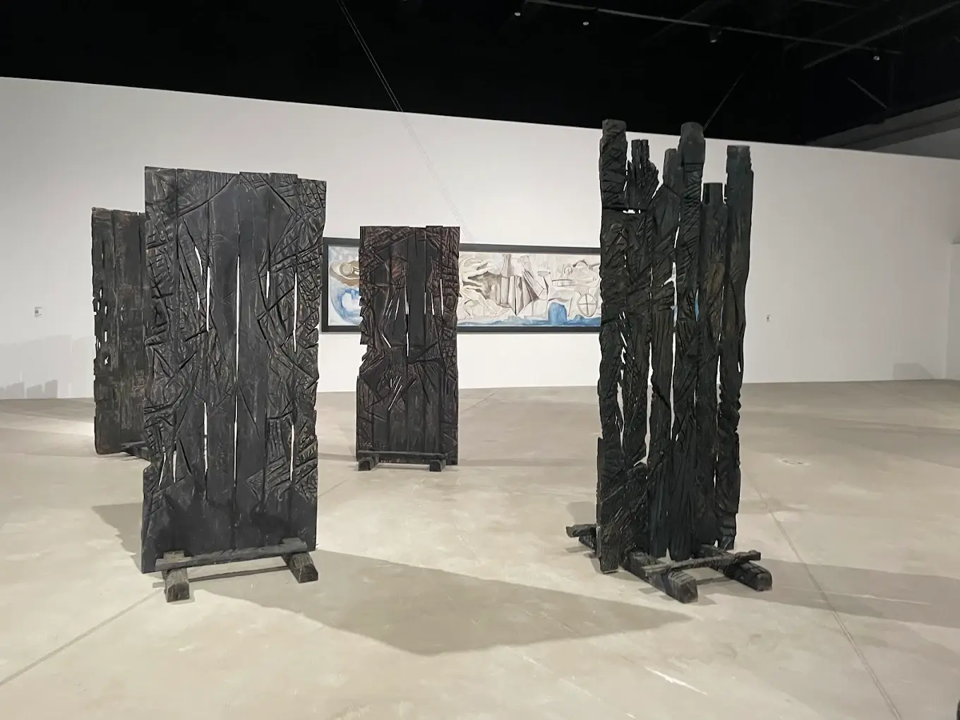 Wooden sculptural installations and abstract wall art are displayed inside YARAT Contemporary Art Space in Baku, showcasing modern Azerbaijani creativity.